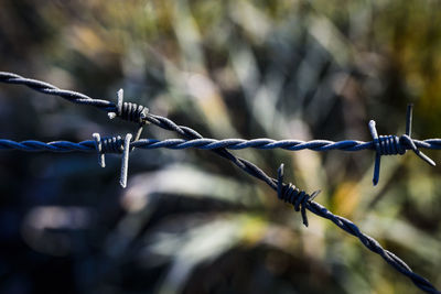 Close-up of barbed wire fence