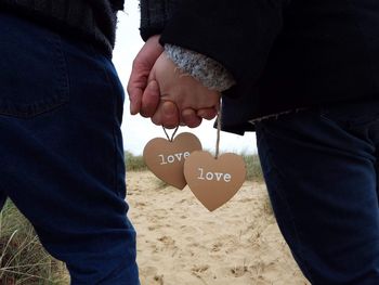 Close-up of hands holding each other