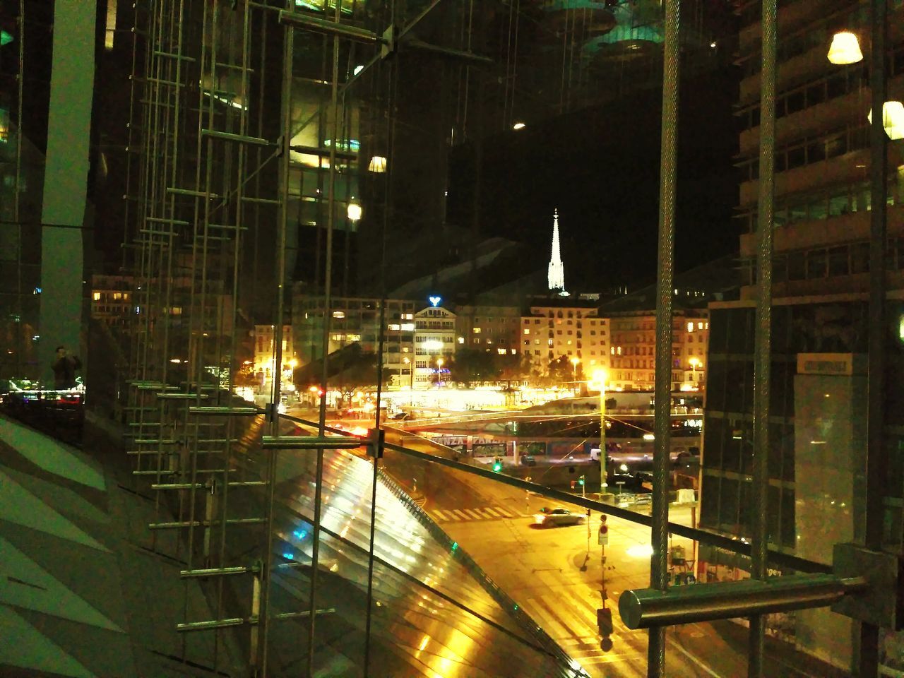 HIGH ANGLE VIEW OF ILLUMINATED CITY STREET