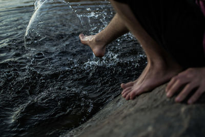 High angle view of man splashing water