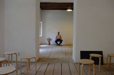 Man sitting on chair at home
