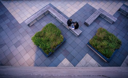 High angle view of people sitting outside building