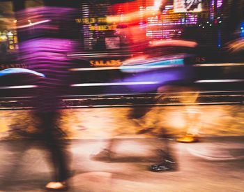 Blurred motion of vehicles on road at night