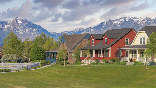 Houses and mountains against sky