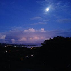 Scenic view of landscape against sky at night