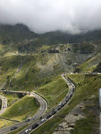 High angle view of winding road on mountain against sky