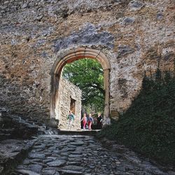 People walking in tunnel