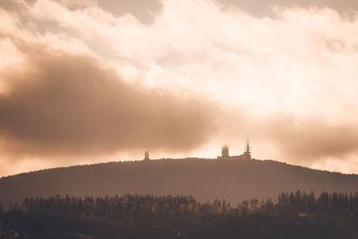 Scenic view of mountains against sky at sunset
