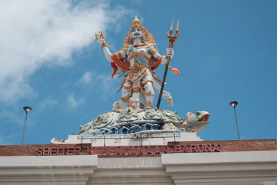 Low angle view of statue against sky