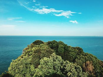 Scenic view of sea against blue sky