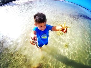 Boy jumping in water