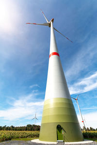 Low angle view of windmill against sky