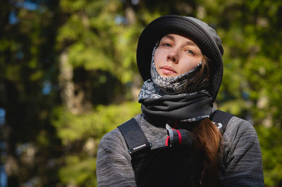 Portrait of young woman standing outdoors