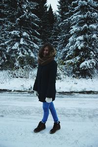 Portrait of woman standing in snow