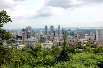 Cityscape against cloudy sky