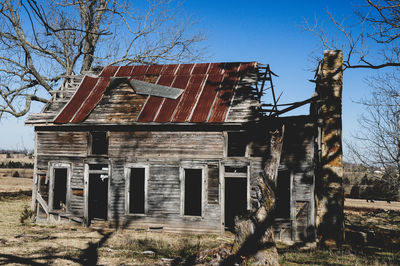 Exterior of abandoned building against sky