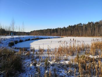 Scenic view of frozen lake against sky