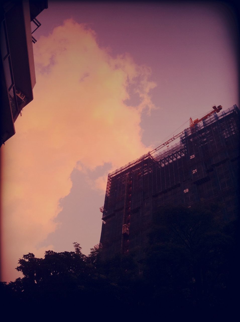 architecture, building exterior, built structure, low angle view, sky, building, sunset, city, residential building, residential structure, silhouette, dusk, cloud - sky, outdoors, house, no people, exterior, tower, auto post production filter, tree