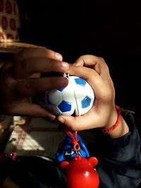 Close-up of woman playing with toy