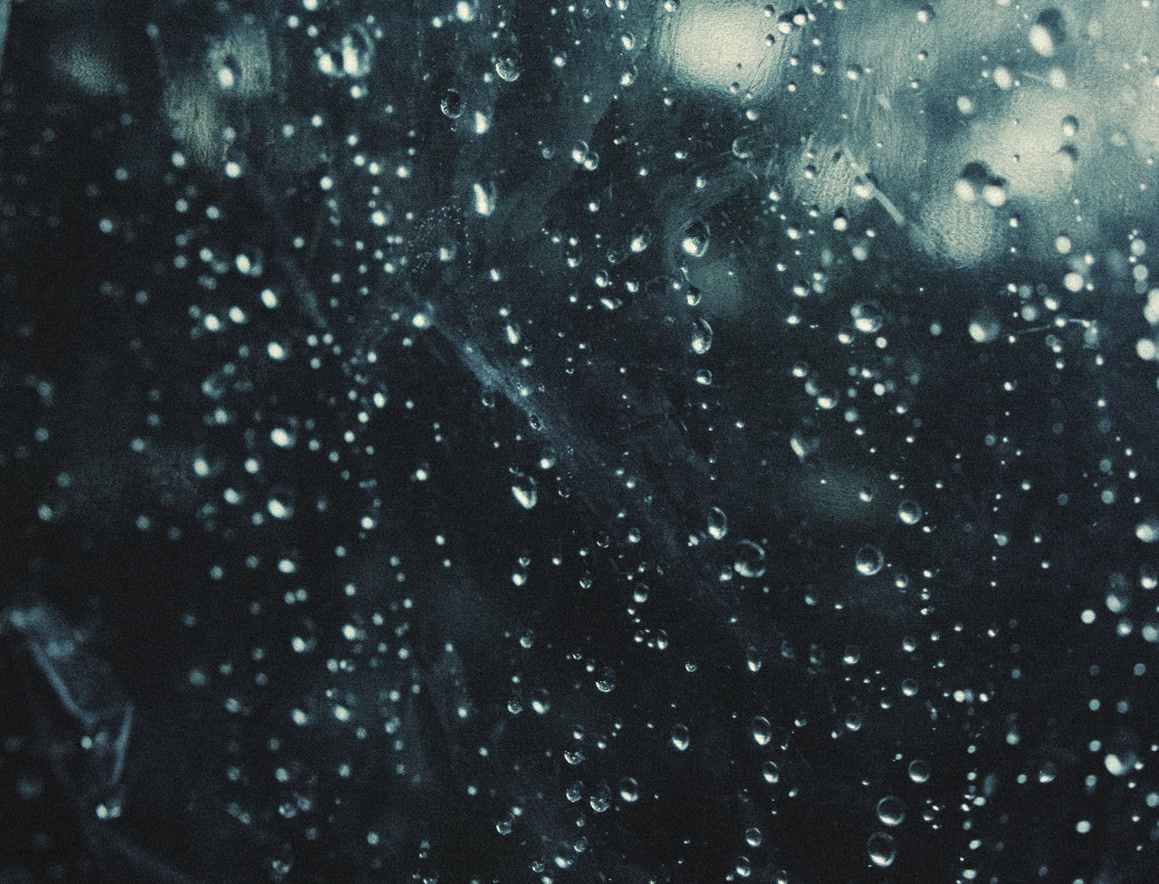 FULL FRAME SHOT OF WET WINDOW IN RAINY SEASON