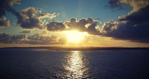 Scenic view of sea at sunset