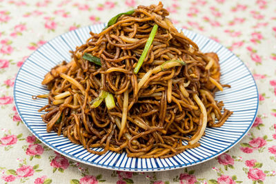 Close-up of noodles in plate on table