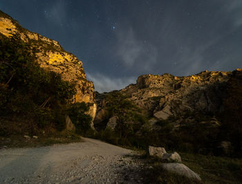 Scenic view of landscape against sky at night