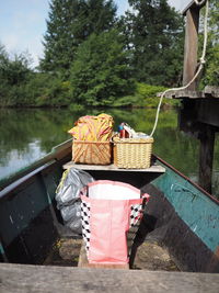 Picnic wicker baskets on boat in lake