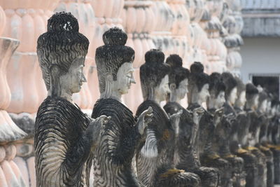Low angle view of buddha statues at temple