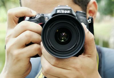 Cropped image of photographer photographing
