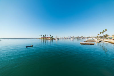 Scenic view of sea against clear blue sky