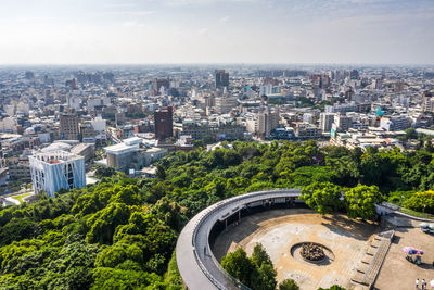 High angle view of buildings in city against sky