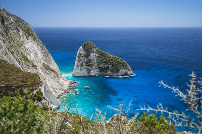 Scenic view of sea against clear blue sky