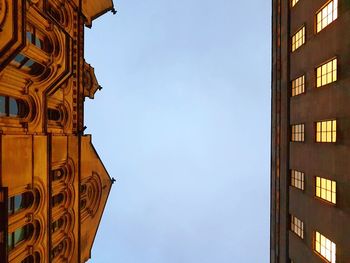 Low angle view of clock tower against clear sky