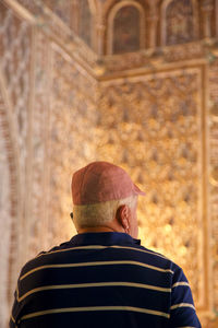 Rear view of men on wall