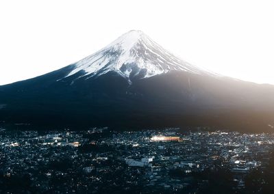 Aerial view of snowcapped mountain against sky