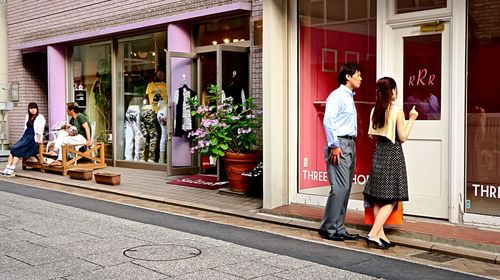 Full length of woman standing in city