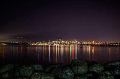 Reflection of illuminated buildings in water