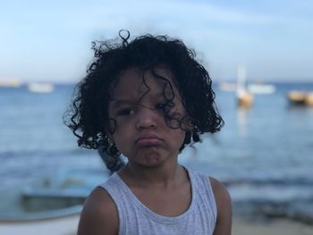 Girl with curly hair at beach