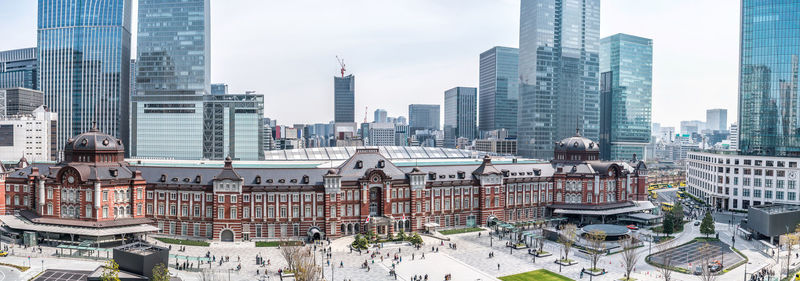 Modern buildings in city against sky