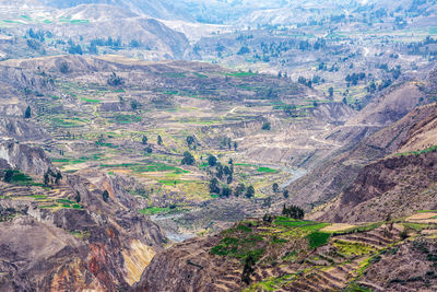 Scenic view of rocky mountains at colca canyon on sunny day