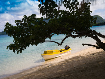 Boat on beach against sky