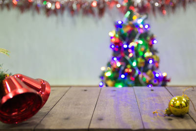 Illuminated christmas tree on floor