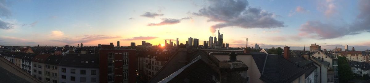 Panoramic view of cityscape against sky during sunset