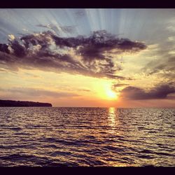 Scenic view of sea at sunset