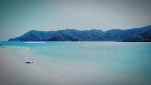 Scenic view of sea against clear blue sky