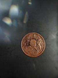 High angle view of coins on table