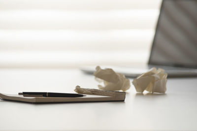 Close-up of paper on table
