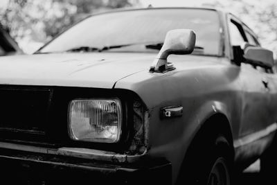 Close-up of vintage car on street