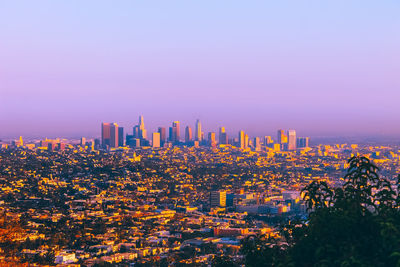 View of modern buildings against sky during sunset